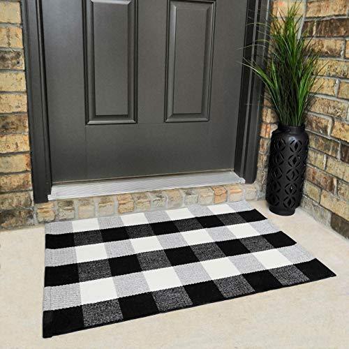 Buffalo check cotton rug placed at front door entrance