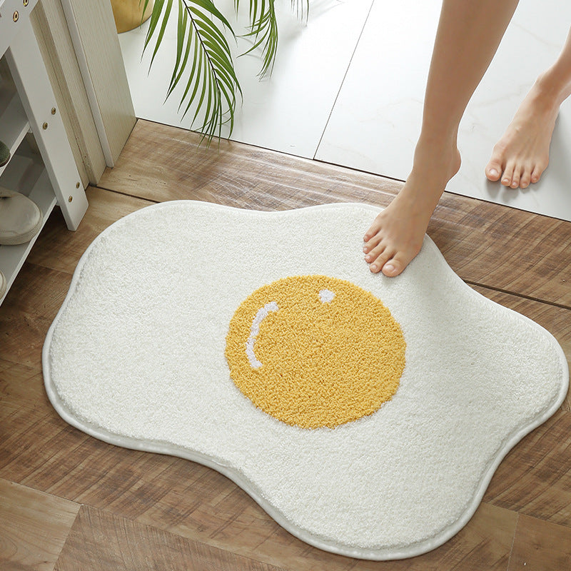 Soft absorbent egg-shaped bathroom rug placed in a modern bathroom.