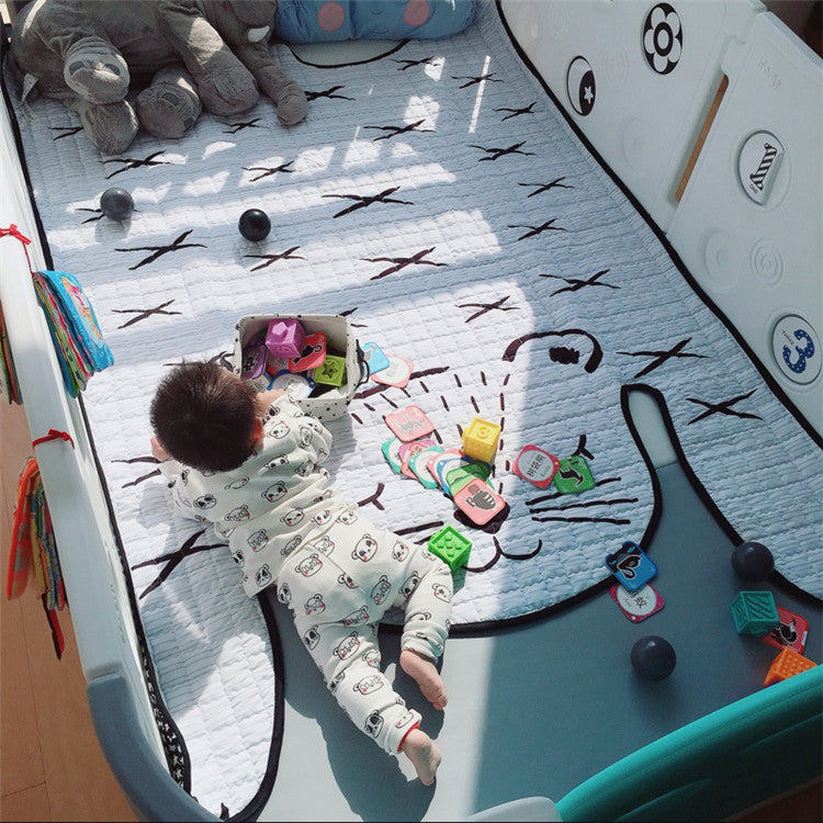 Soft animal-shaped kids rug placed in a nursery play area with toys