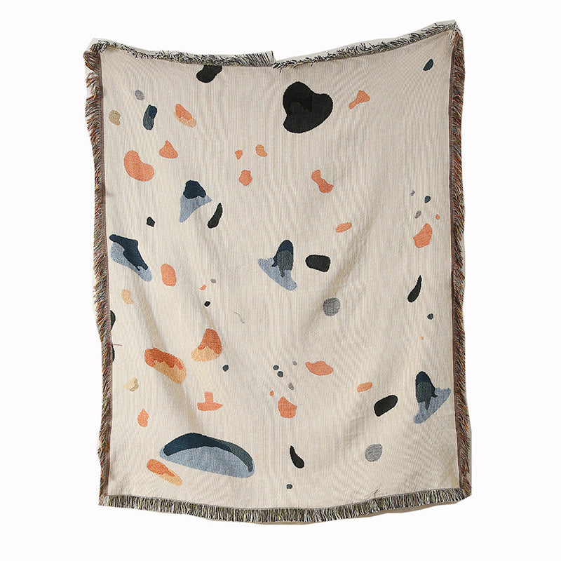 Throw blanket close-up of modern shell-pattern fabric texture