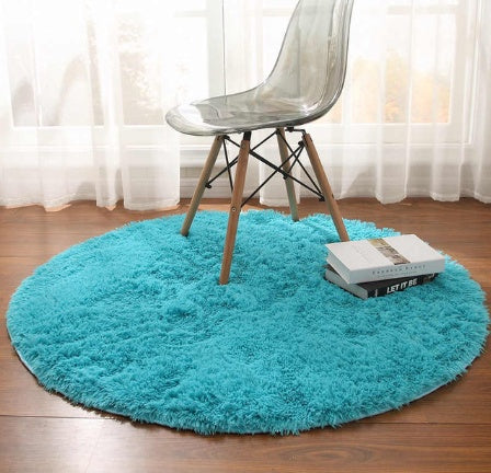 Aqua blue round plush rug used as cozy floor decor