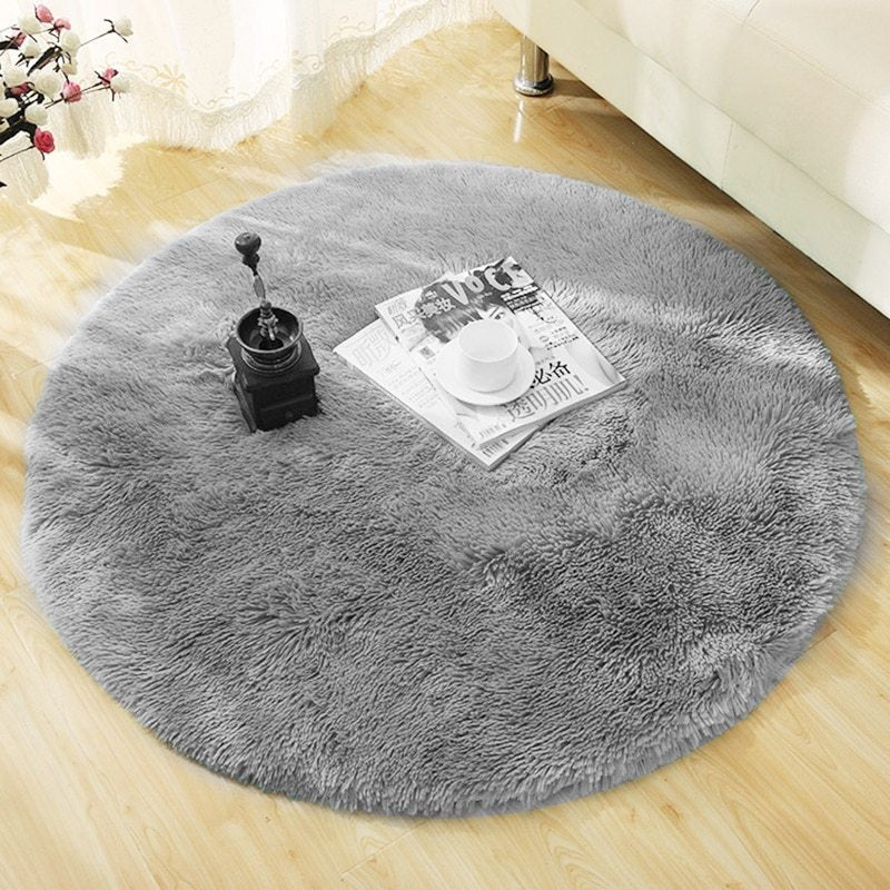 Grey round faux fur rug styled in modern interior
