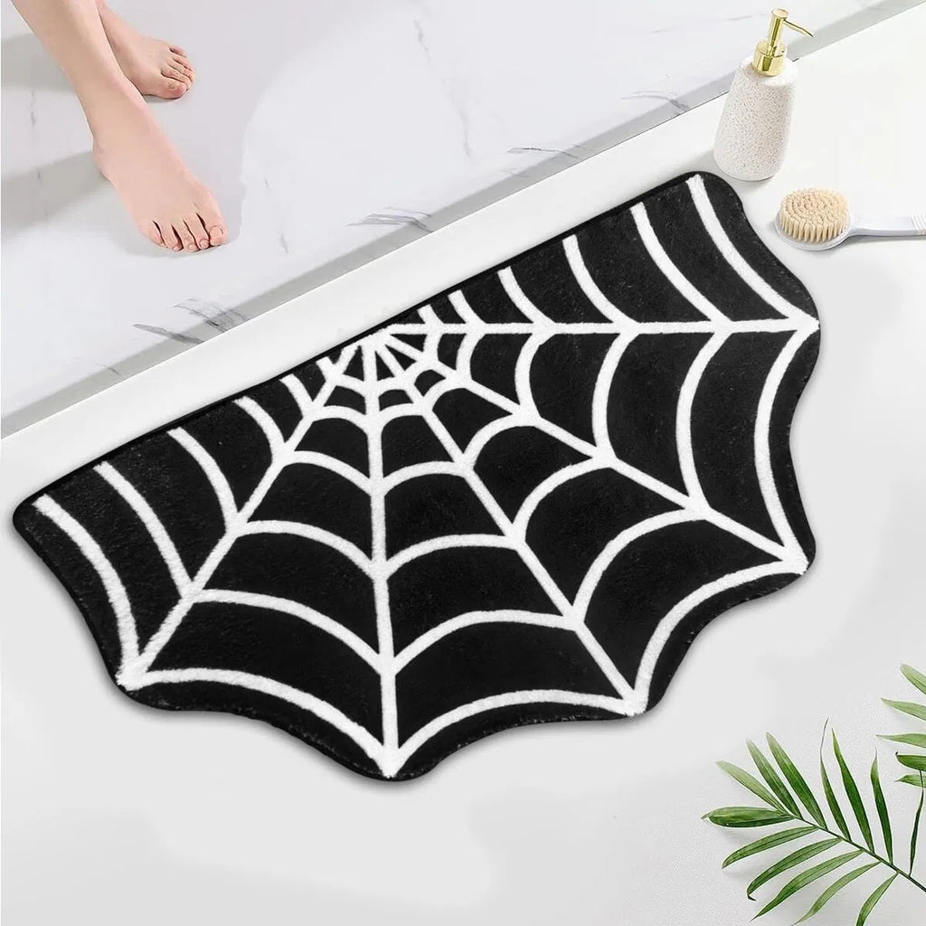 Spider web shaped black and white bath mat on white background